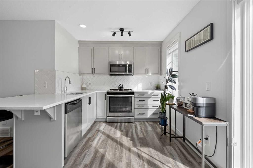 103 Cranbrook Walk Se, Calgary, AB - Indoor Photo Showing Kitchen With Stainless Steel Kitchen With Upgraded Kitchen