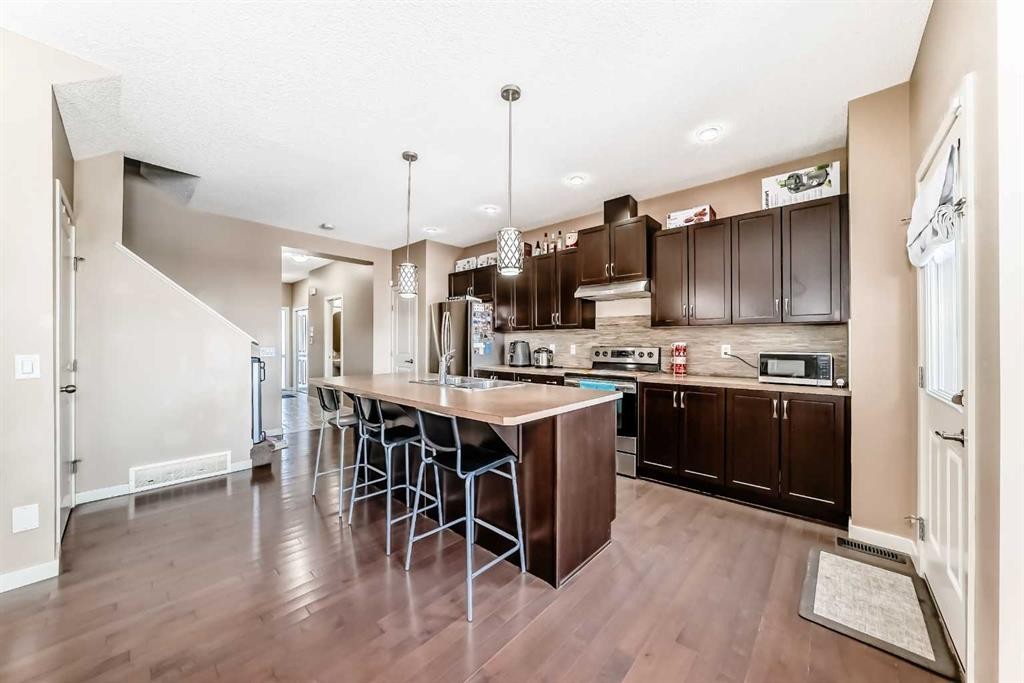302 Auburn Crest Way Se, Calgary, AB - Indoor Photo Showing Kitchen With Stainless Steel Kitchen With Upgraded Kitchen