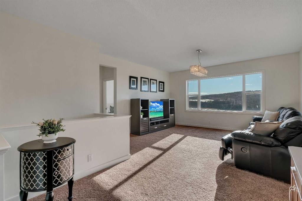 287 Sunset View, Cochrane, AB - Indoor Photo Showing Other Room
