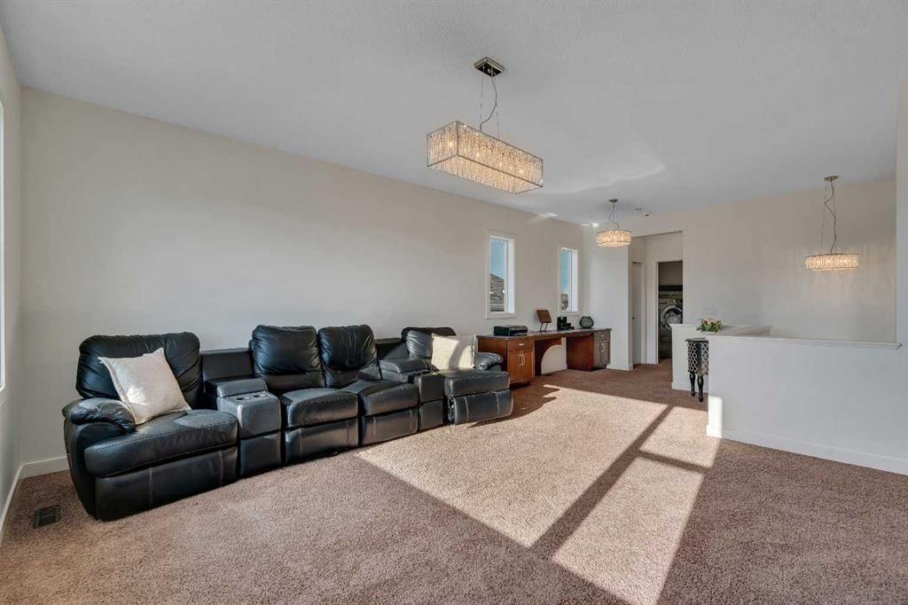 287 Sunset View, Cochrane, AB - Indoor Photo Showing Living Room