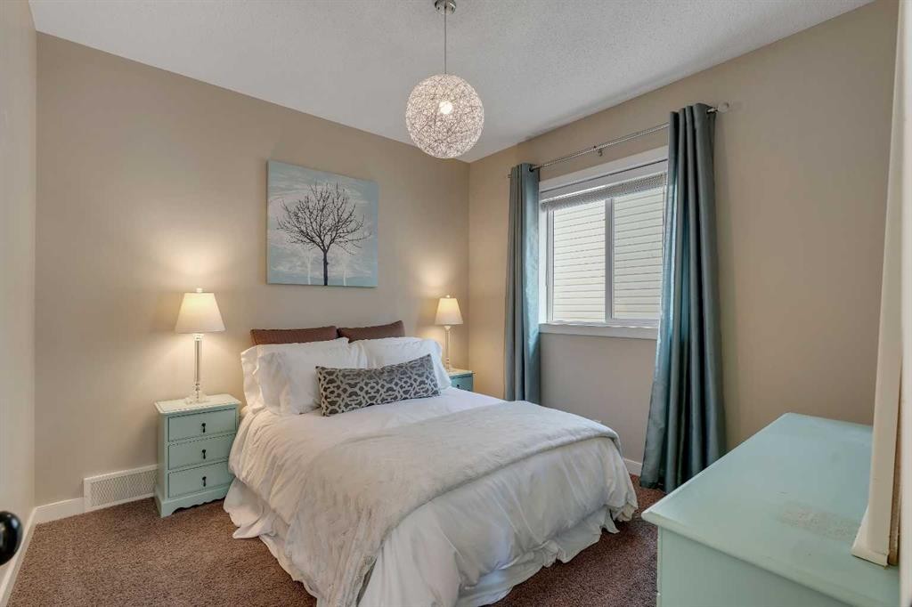 287 Sunset View, Cochrane, AB - Indoor Photo Showing Bedroom