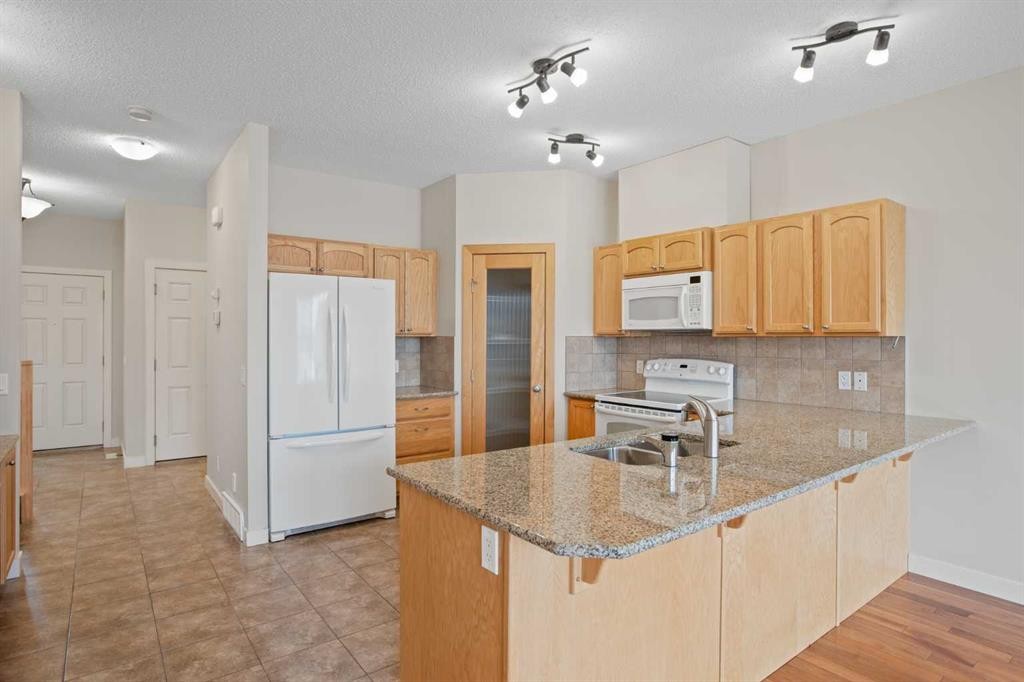 36-351 Monteith Drive Se, High River, AB - Indoor Photo Showing Kitchen With Double Sink