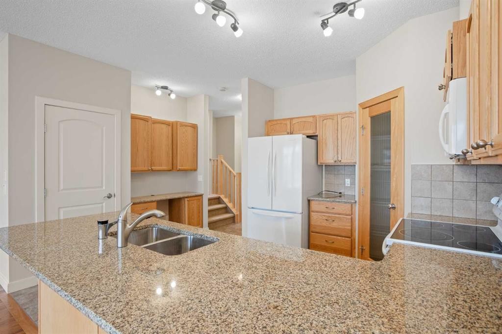 36-351 Monteith Drive Se, High River, AB - Indoor Photo Showing Kitchen With Double Sink