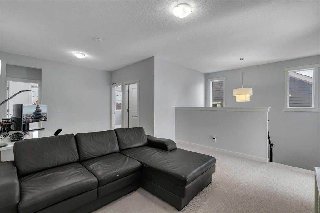 151 Stonemere Green, Chestermere, AB - Indoor Photo Showing Living Room