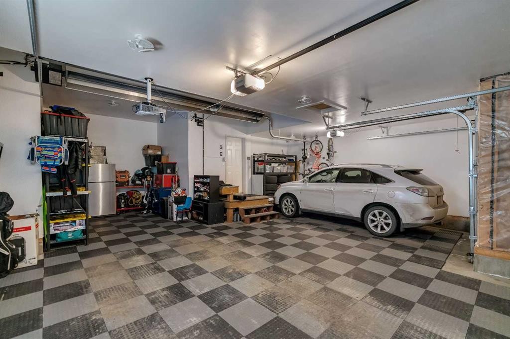 151 Stonemere Green, Chestermere, AB - Indoor Photo Showing Garage