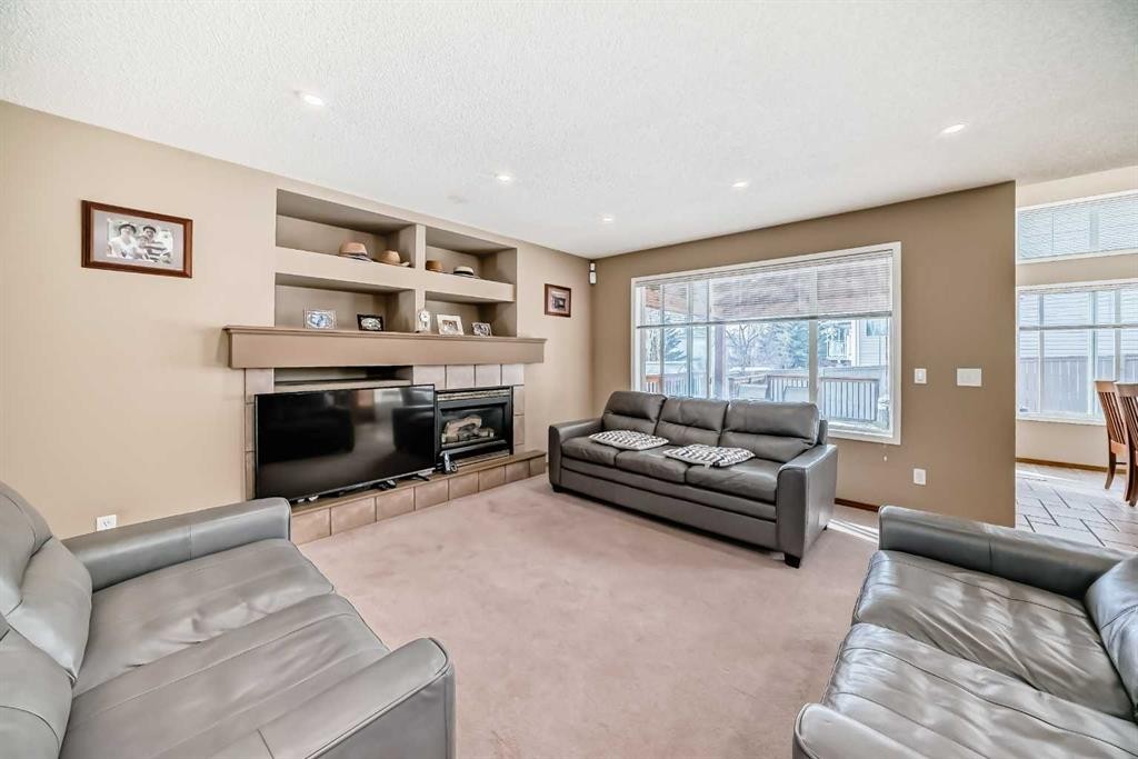 3767 Springbank Drive Sw, Calgary, AB - Indoor Photo Showing Living Room With Fireplace