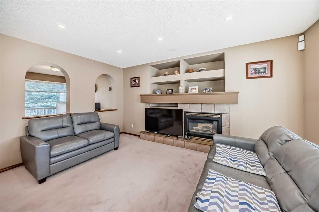 3767 Springbank Drive Sw, Calgary, AB - Indoor Photo Showing Living Room With Fireplace