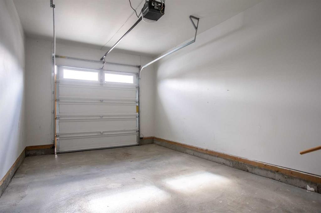 100-351 Monteith Drive Se, High River, AB - Indoor Photo Showing Garage
