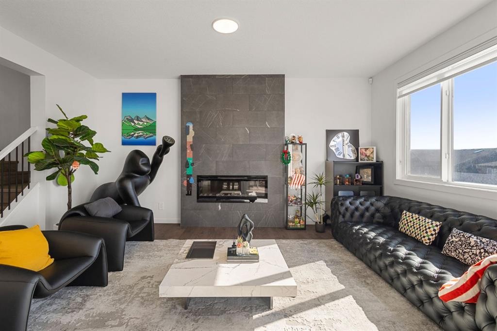 75 Royston Heath Nw, Calgary, AB - Indoor Photo Showing Living Room With Fireplace