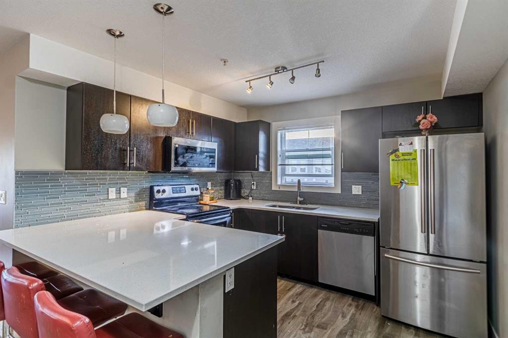 302-2300 Evanston Square Nw, Calgary, AB - Indoor Photo Showing Kitchen With Upgraded Kitchen