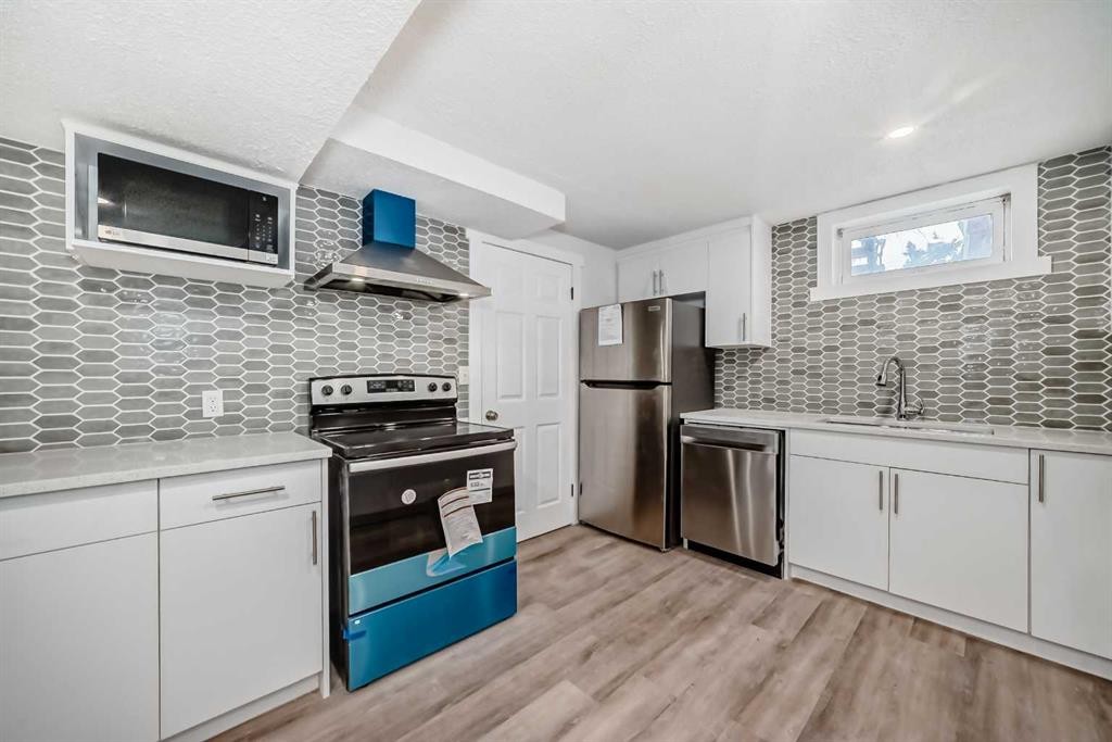 23 Marbank Way Ne, Calgary, AB - Indoor Photo Showing Kitchen With Upgraded Kitchen
