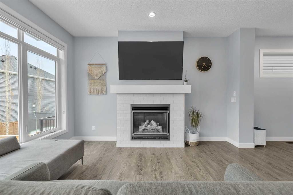 78 Sage Bluff View Nw, Calgary, AB - Indoor Photo Showing Living Room With Fireplace