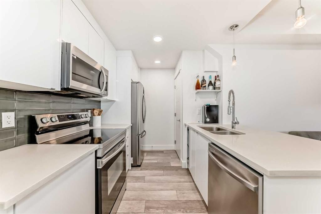 4697 Seton Drive Se, Calgary, AB - Indoor Photo Showing Kitchen With Stainless Steel Kitchen With Double Sink