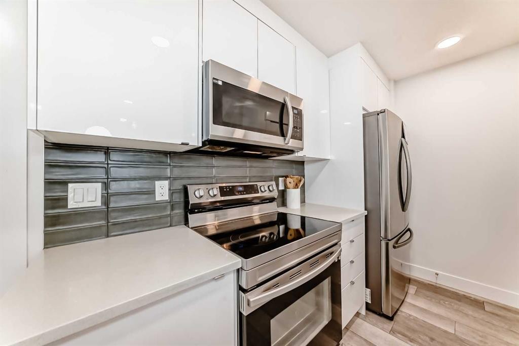 4697 Seton Drive Se, Calgary, AB - Indoor Photo Showing Kitchen With Stainless Steel Kitchen