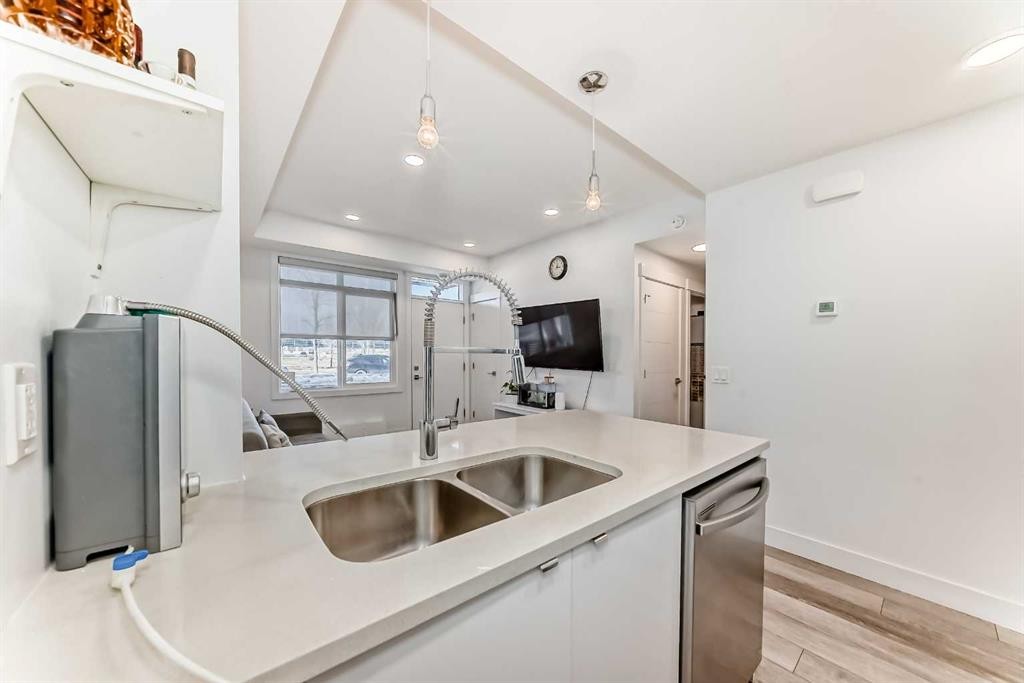 4697 Seton Drive Se, Calgary, AB - Indoor Photo Showing Kitchen With Double Sink