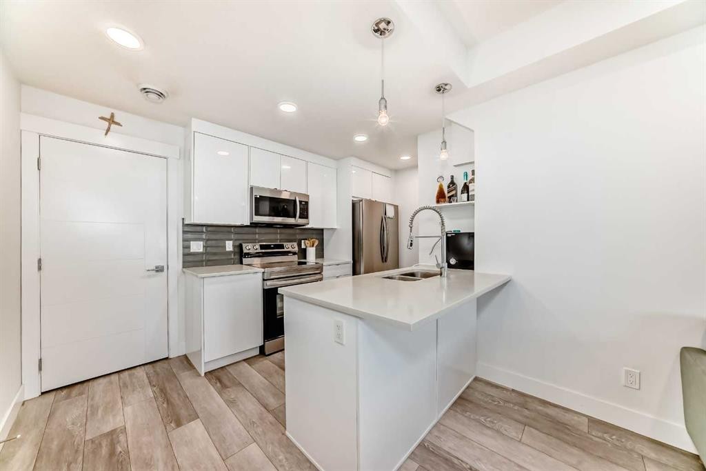 4697 Seton Drive Se, Calgary, AB - Indoor Photo Showing Kitchen With Double Sink With Upgraded Kitchen