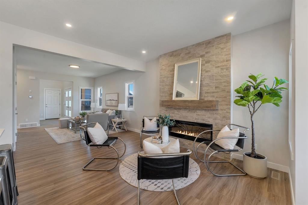 11 Fireside Common, Cochrane, AB - Indoor Photo Showing Living Room With Fireplace