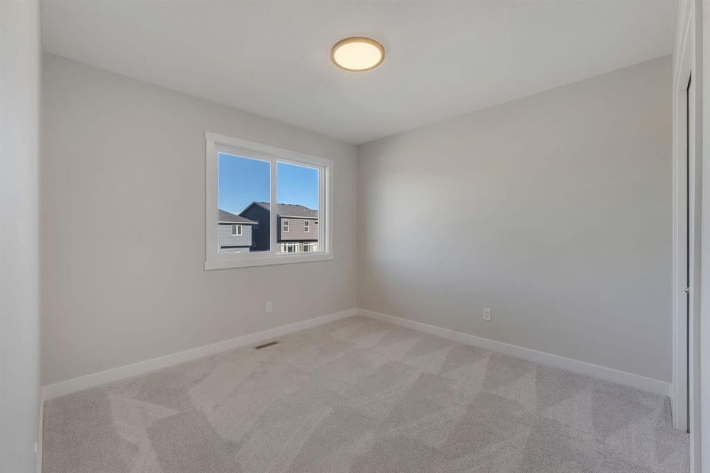 11 Fireside Common, Cochrane, AB - Indoor Photo Showing Other Room