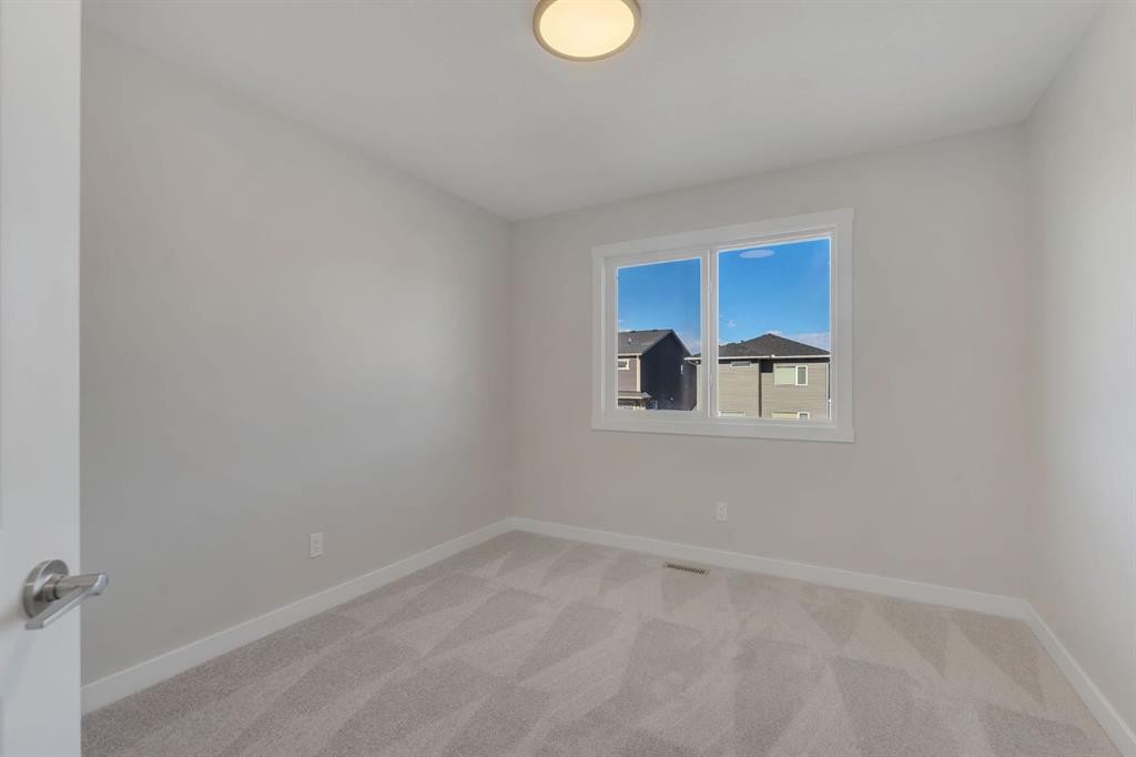 11 Fireside Common, Cochrane, AB - Indoor Photo Showing Other Room