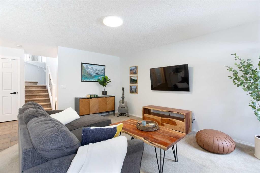 54 Springborough Point Sw, Calgary, AB - Indoor Photo Showing Living Room
