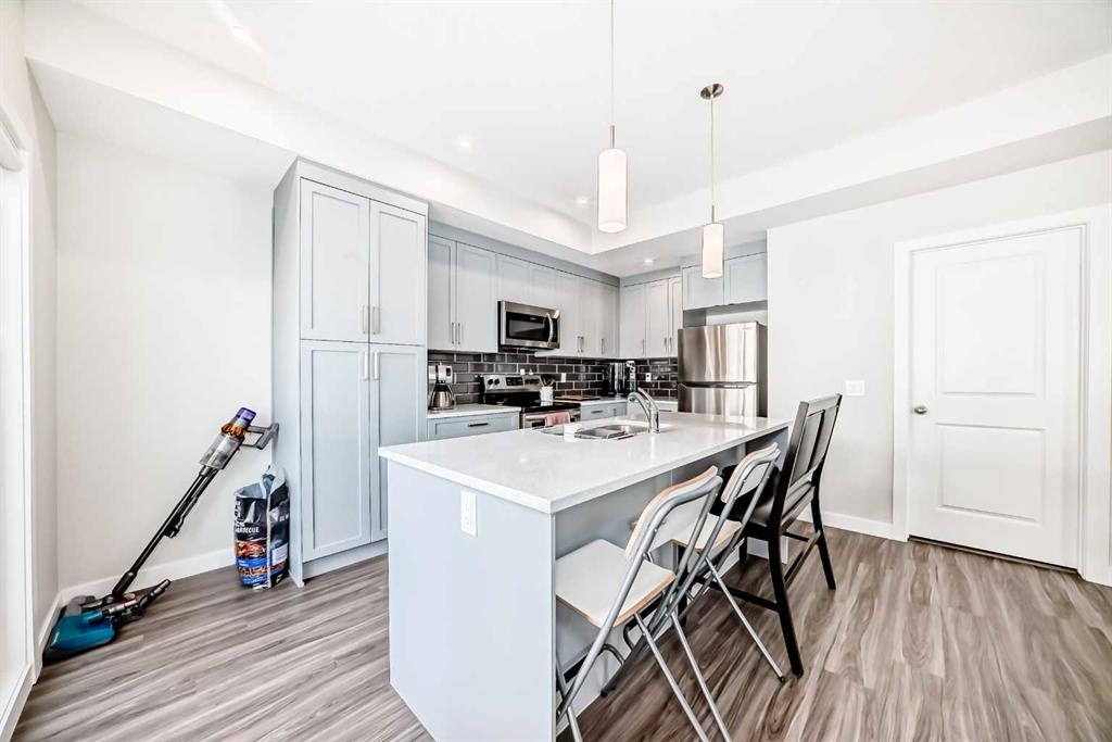 294 Canals Crossing Sw, Airdrie, AB - Indoor Photo Showing Kitchen With Upgraded Kitchen