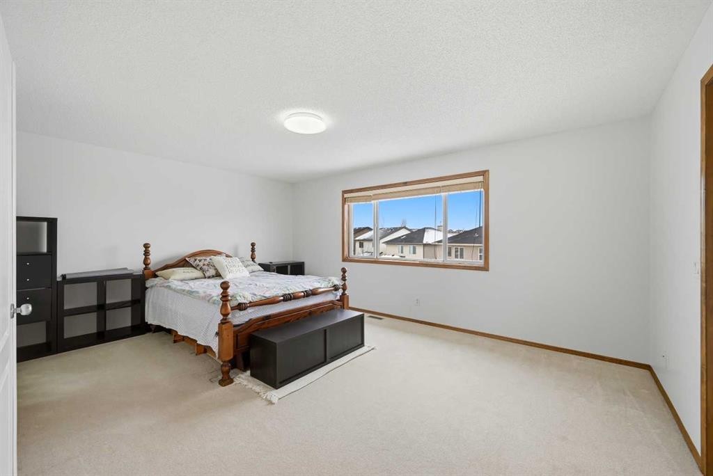125 Panamount Heath Nw, Calgary, AB - Indoor Photo Showing Bedroom