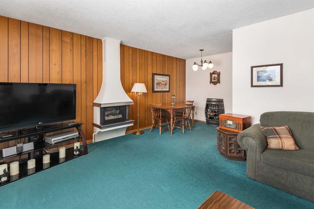 5039 Nemiskam Road Nw, Calgary, AB - Indoor Photo Showing Other Room With Fireplace