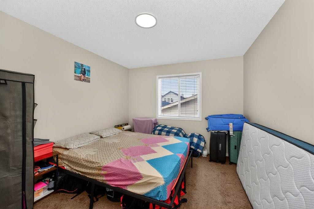 246 Saddlebrook Way Ne, Calgary, AB - Indoor Photo Showing Bedroom