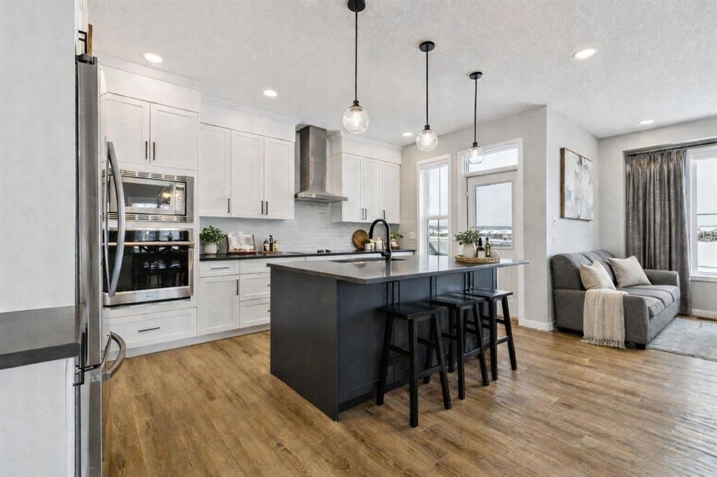 103 Saddlebred Link, Cochrane, AB - Indoor Photo Showing Kitchen With Stainless Steel Kitchen With Upgraded Kitchen