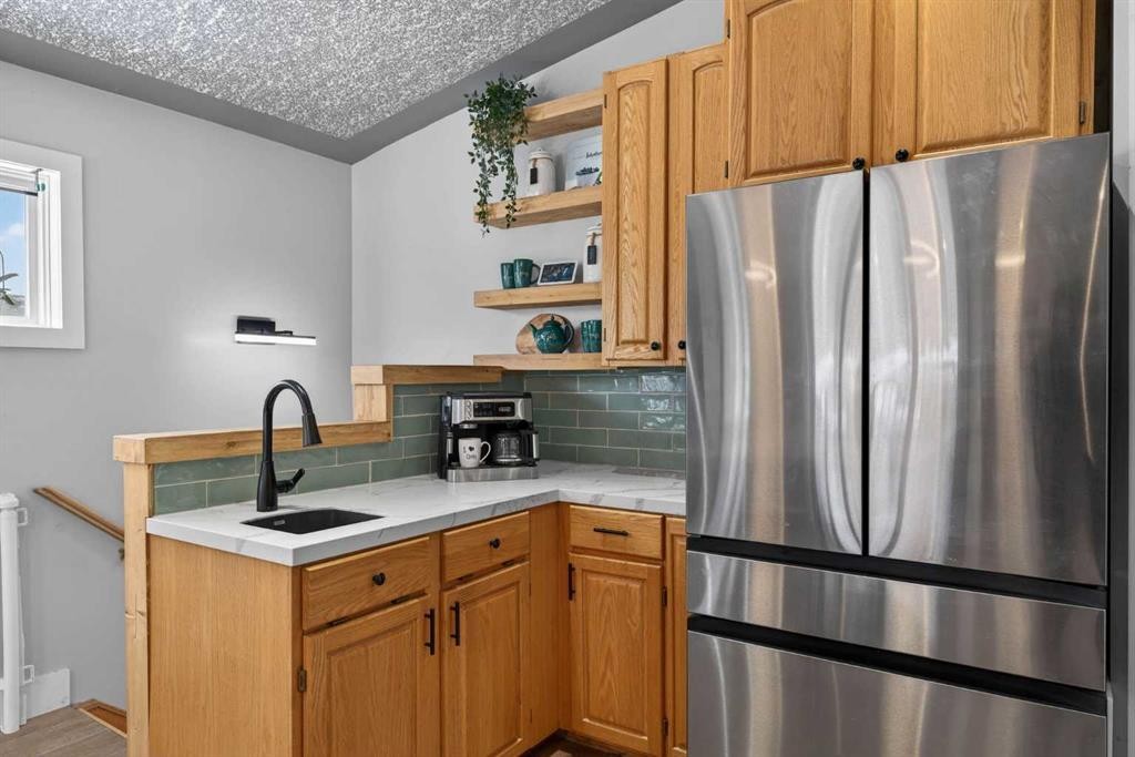 64 Foxwell Road Se, Calgary, AB - Indoor Photo Showing Kitchen With Stainless Steel Kitchen