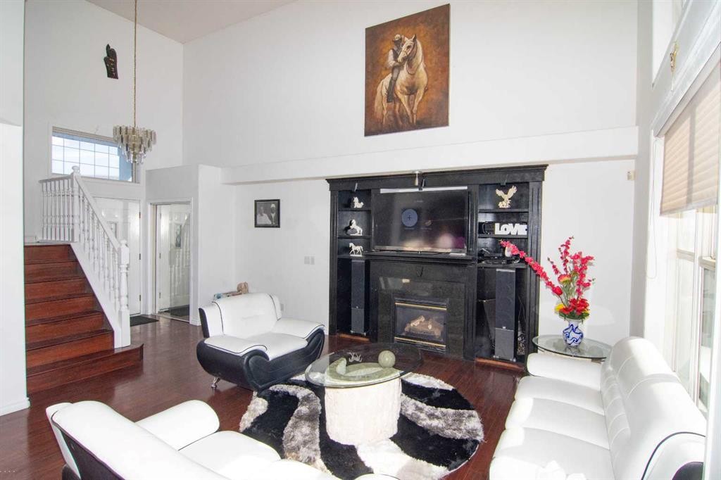 47 Anaheim Crescent Ne, Calgary, AB - Indoor Photo Showing Other Room With Fireplace