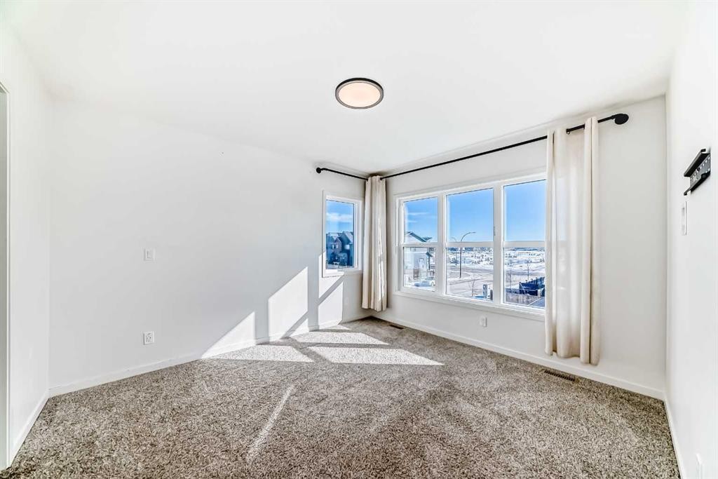 120 Seton Villas Se, Calgary, AB - Indoor Photo Showing Other Room