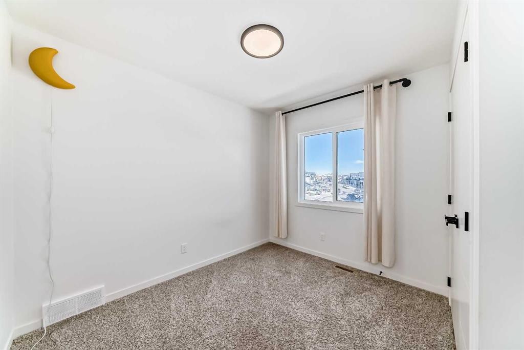 120 Seton Villas Se, Calgary, AB - Indoor Photo Showing Other Room