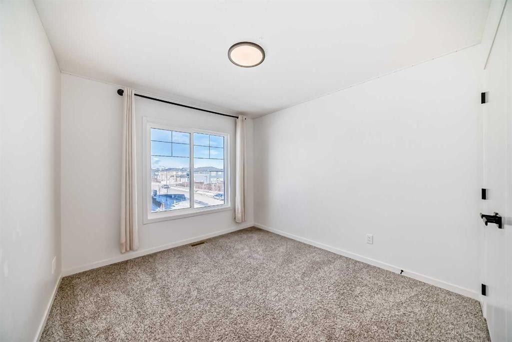 120 Seton Villas Se, Calgary, AB - Indoor Photo Showing Other Room