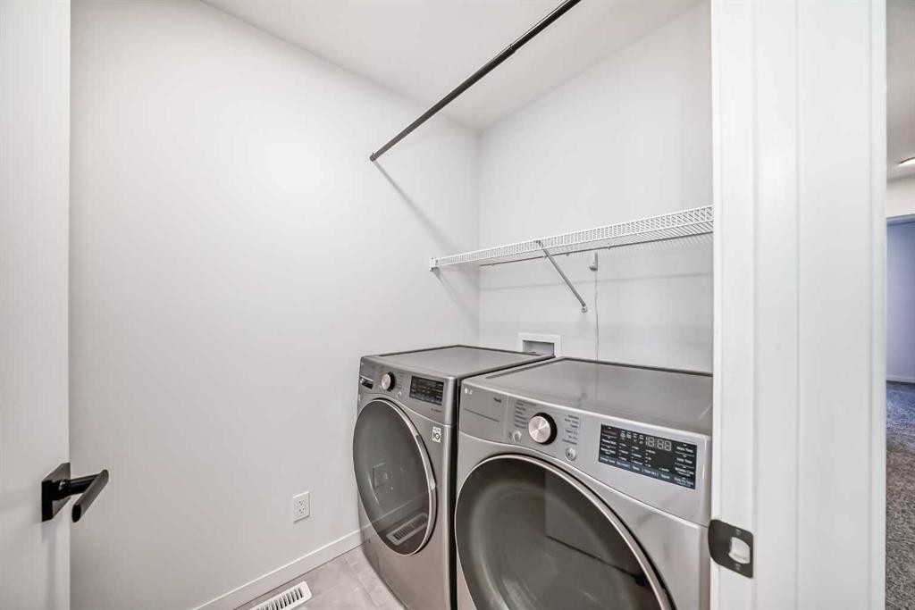 120 Seton Villas Se, Calgary, AB - Indoor Photo Showing Laundry Room