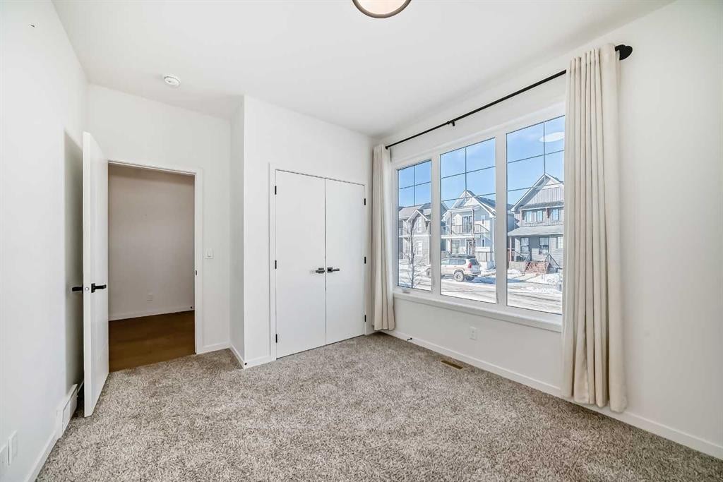 120 Seton Villas Se, Calgary, AB - Indoor Photo Showing Other Room