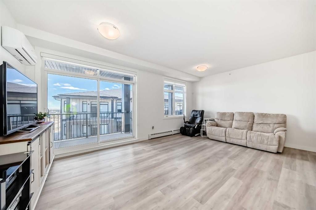 2416-200 Seton Circle Se, Calgary, AB - Indoor Photo Showing Living Room