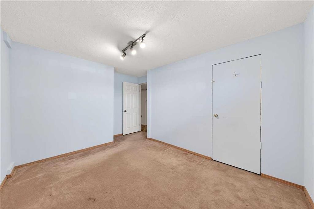 215 Pinegrove Close Ne, Calgary, AB - Indoor Photo Showing Other Room