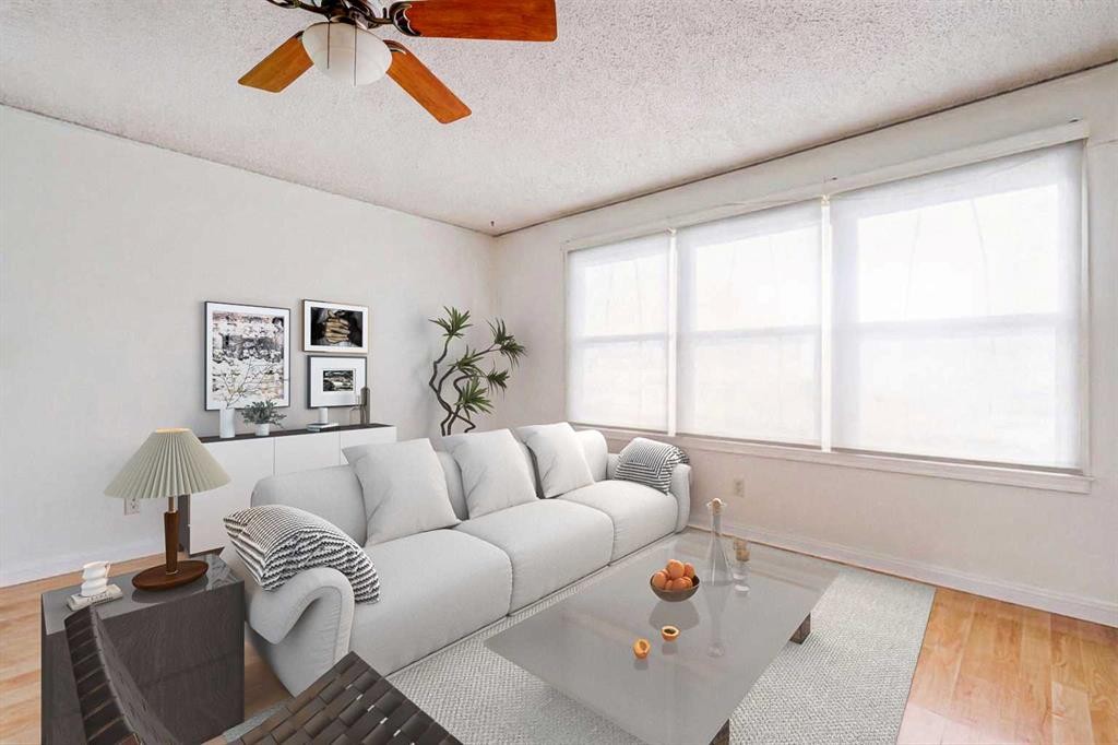 55 Queen Isabella Close Se, Calgary, AB - Indoor Photo Showing Living Room