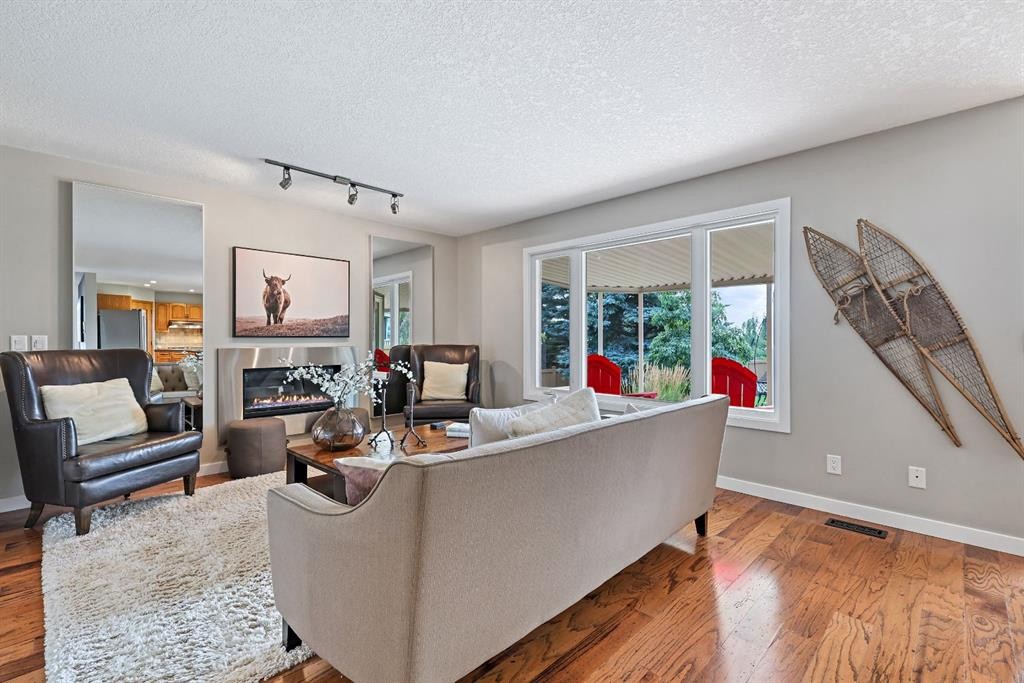 33 Sunset Crescent, Okotoks, AB - Indoor Photo Showing Living Room With Fireplace