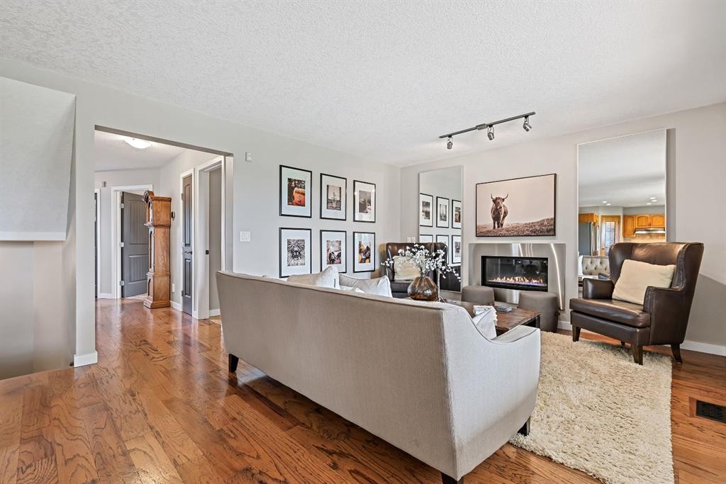 33 Sunset Crescent, Okotoks, AB - Indoor Photo Showing Living Room With Fireplace
