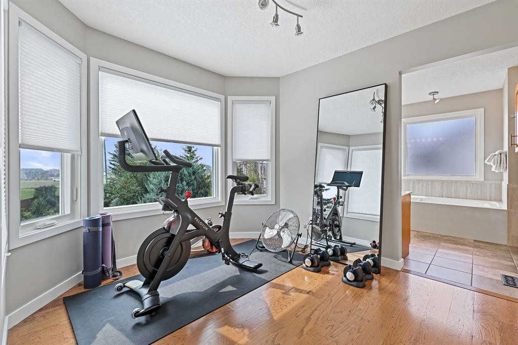 33 Sunset Crescent, Okotoks, AB - Indoor Photo Showing Gym Room