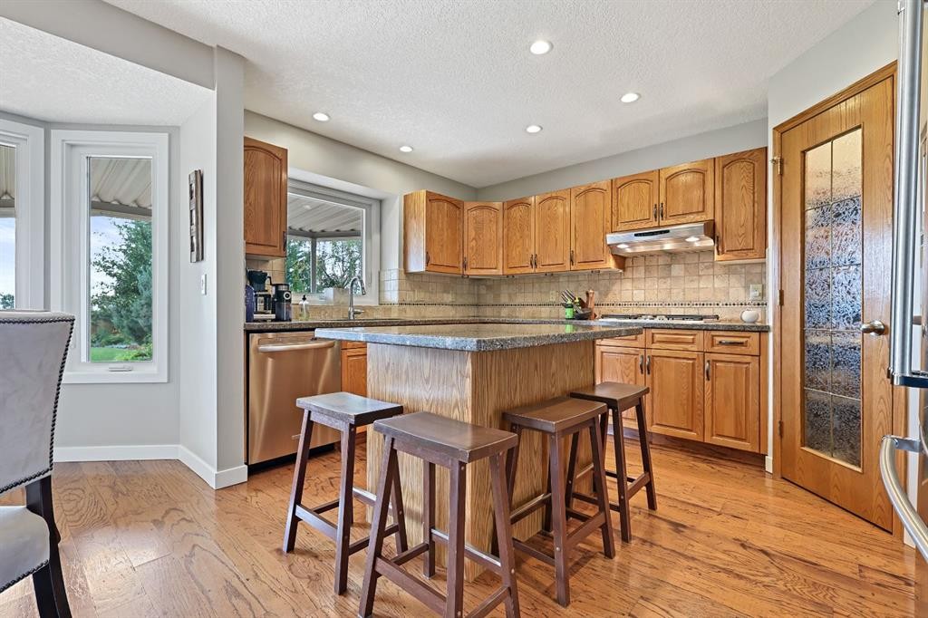 33 Sunset Crescent, Okotoks, AB - Indoor Photo Showing Kitchen With Stainless Steel Kitchen