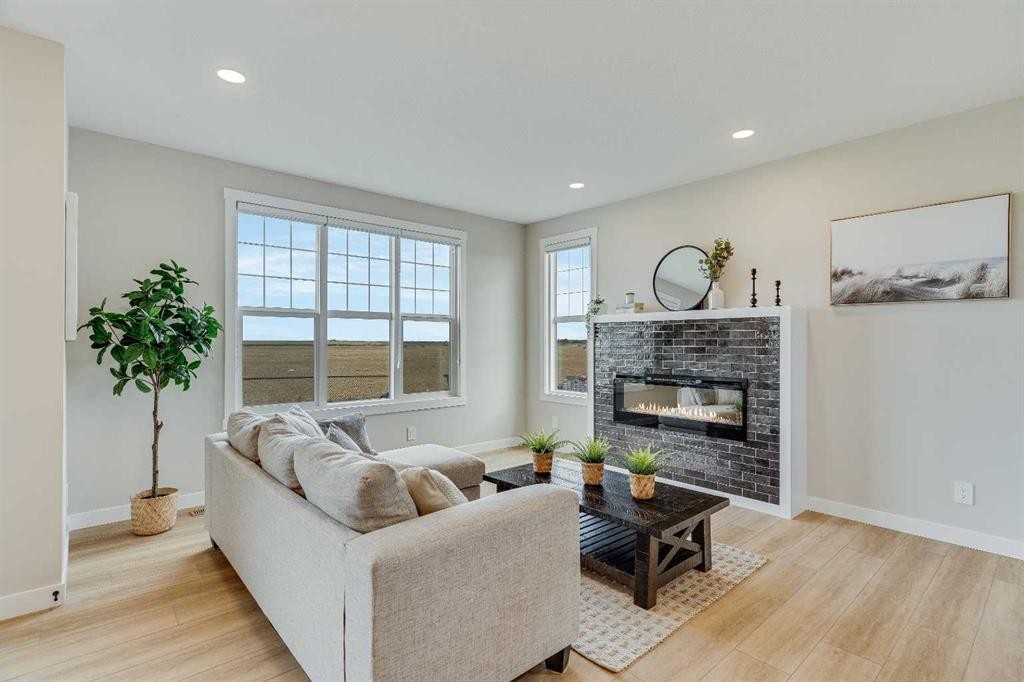 467 Kinniburgh Loop, Chestermere, AB - Indoor Photo Showing Living Room With Fireplace
