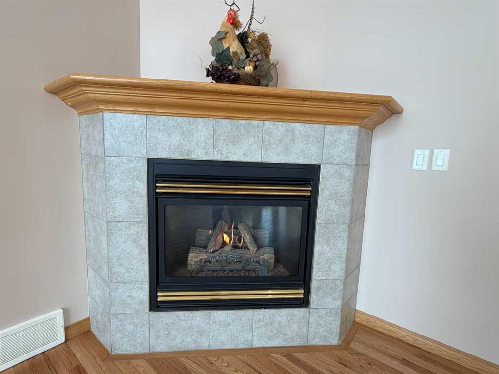 5111 Shannon Drive, Olds, AB - Indoor Photo Showing Living Room With Fireplace