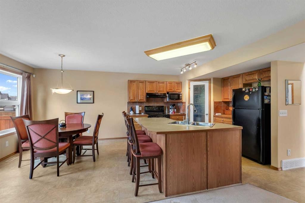 214 Saddlemont Boulevard Ne, Calgary, AB - Indoor Photo Showing Kitchen With Double Sink