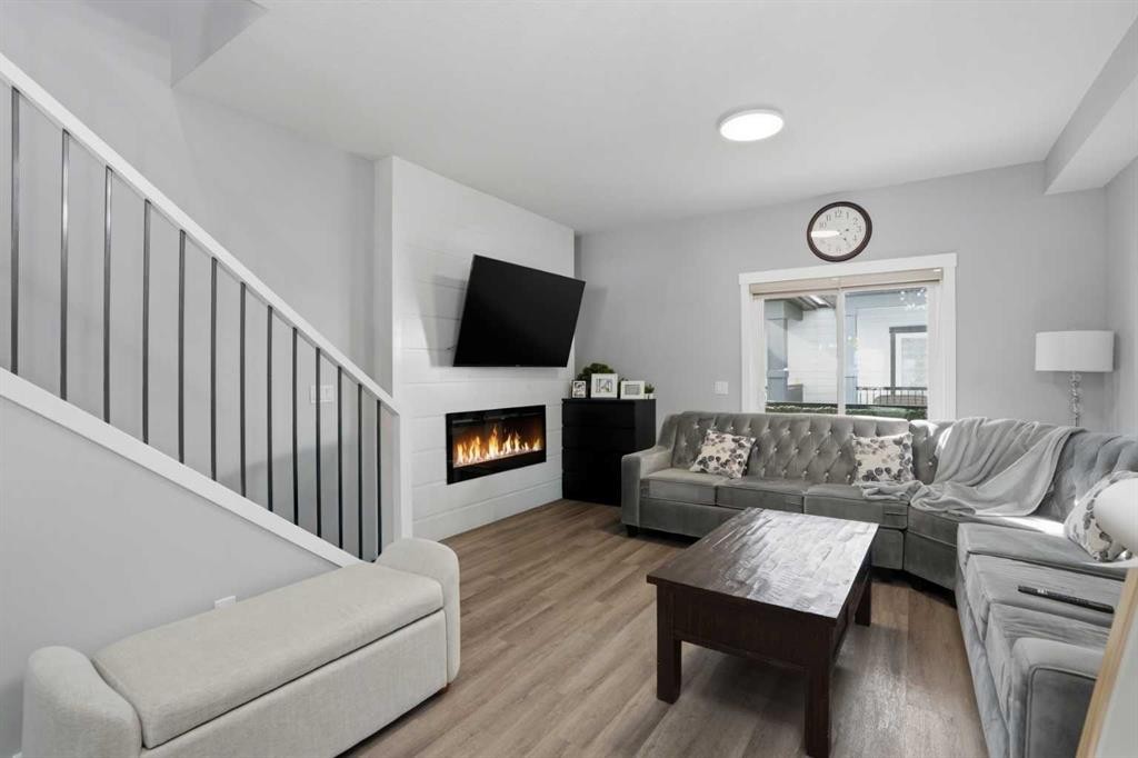404-95 Skyview Close Ne, Calgary, AB - Indoor Photo Showing Living Room With Fireplace