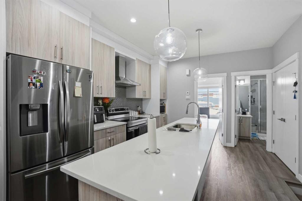 404-95 Skyview Close Ne, Calgary, AB - Indoor Photo Showing Kitchen With Stainless Steel Kitchen With Double Sink With Upgraded Kitchen