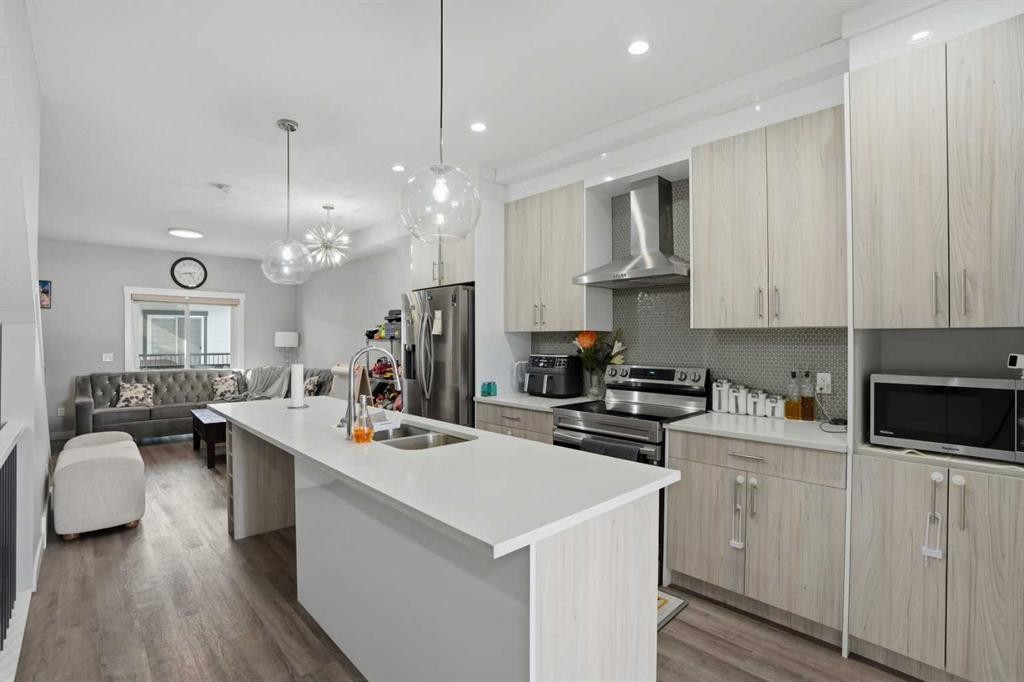 404-95 Skyview Close Ne, Calgary, AB - Indoor Photo Showing Kitchen With Stainless Steel Kitchen With Double Sink With Upgraded Kitchen
