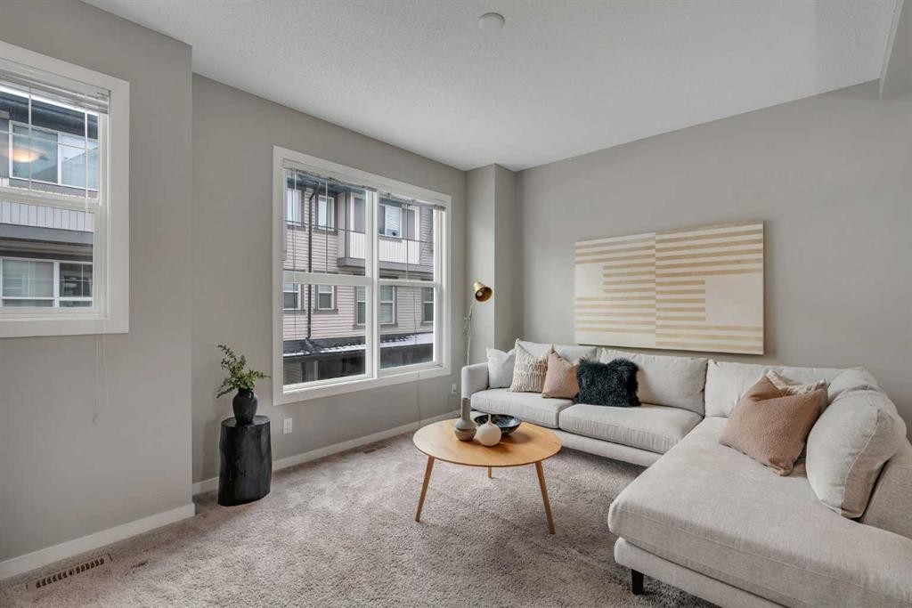 34 New Brighton Point Se, Calgary, AB - Indoor Photo Showing Living Room